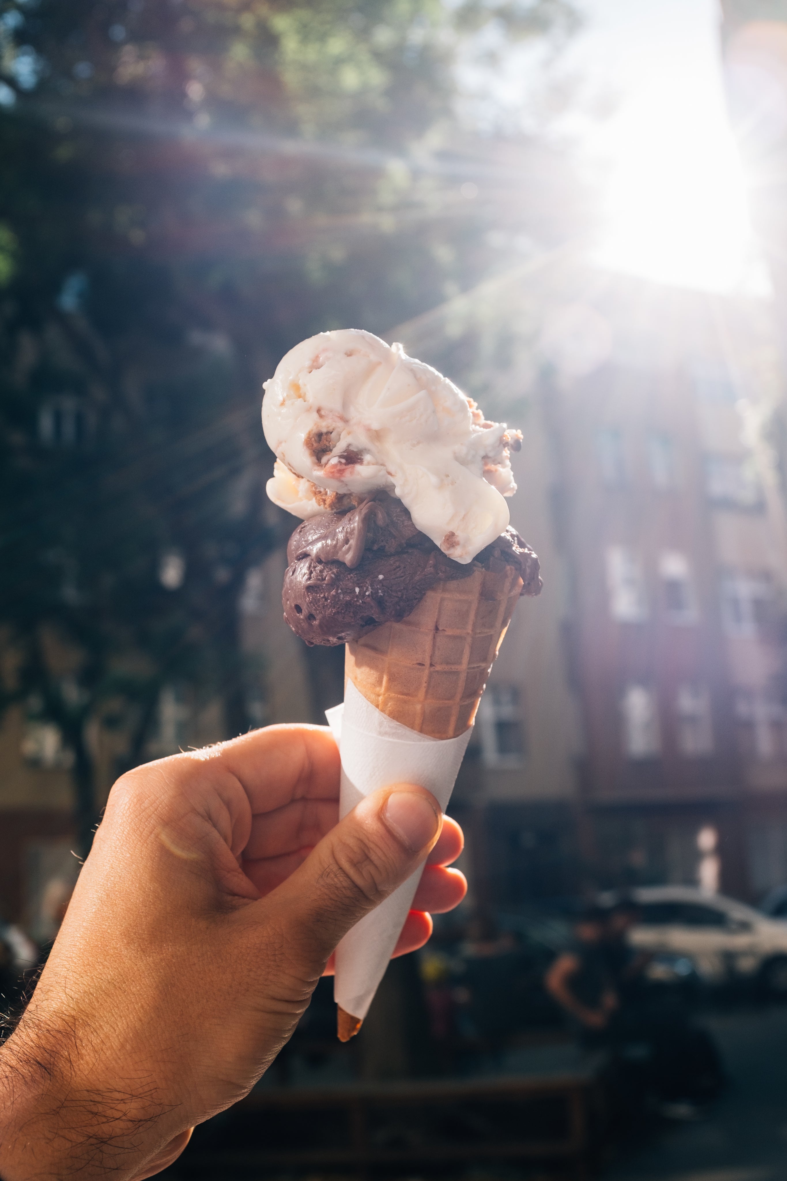 files/hand-holds-up-a-two-scoop-ice-cream-cone.jpg